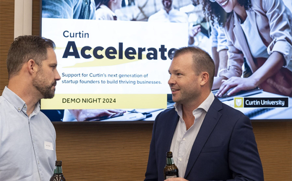 Two men talking at the Curtin Accelerate pitch night